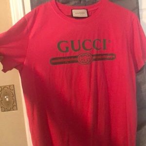 A pink Gucci shirt